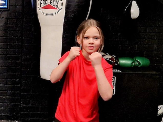 Kids boxing training session with junior boxer practicing techniques at Boxing Fitness MK