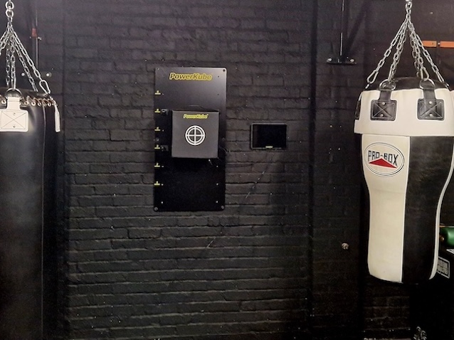 Wall-mounted punching bags at Boxing Fitness MK gym training facility in Milton Keynes