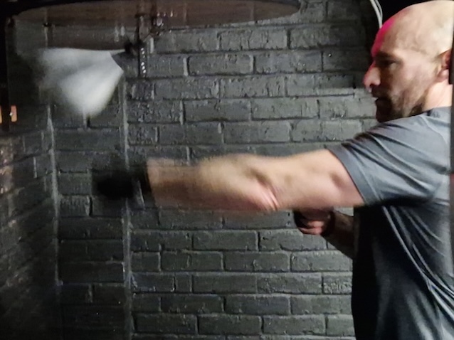 Man practicing speed bag boxing drills for hand-eye coordination and fitness at Boxing Fitness MK